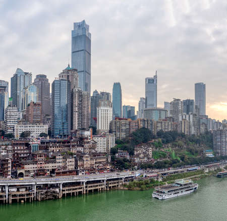 Chongqing, China - Dec 22, 2019: CBD Skyscrapers near Hongya dong cave by Jialing riverのeditorial素材