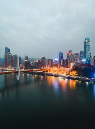 Dec 22, 2019 - Chongqing, China: Aerial drone shot of Hong Ya Dong cave before night by Jialing riverのeditorial素材