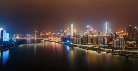 Dec 22, 2019 - Chongqing, China: Panoramic aerial night view of Hong Ya Dong cave by Jialing riverのeditorial素材
