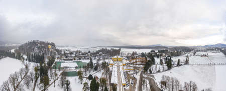 Aerial view of Schloss Hellbrunn covered in snow near Salzburg outskirts in winter timeの写真素材