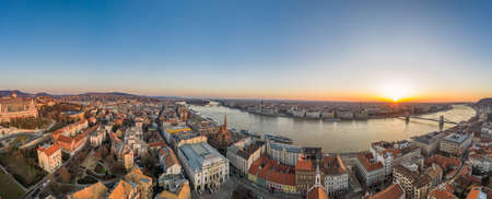 Panoramic aerial drone shot of Budapest skyline sunrise over Danube river with Hungarian Parliamentの写真素材