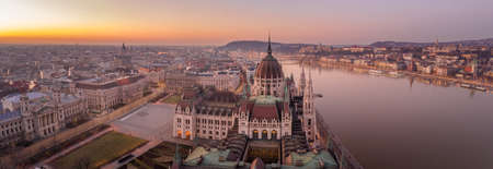 Panoramic aerial drone shot of Dome of Hungarian Parliament at dawn before sunrise in Budapest morningの写真素材