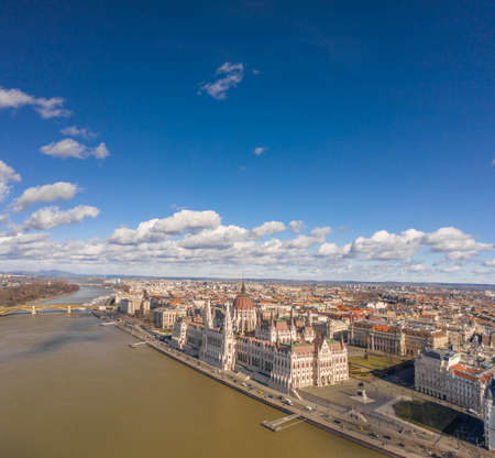 Aerial drone shot of Hungarian Parliament with clouds in Budapest Winter morning timeの写真素材