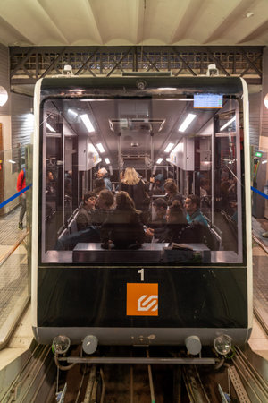 Barcelona, Spain - Feb 24, 2020: People in Funicular on Mount Tibidabo at night