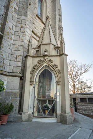 Bell tower of temple of Expiatori del Sagrat Cor on top of Mont Tibidabo in Barcelona Spain in winter afternoonの写真素材