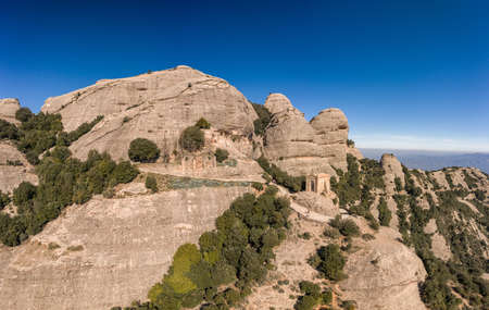 Aerial drone shot of Sant Jeroni peak on Montserrat near Barcelona in winter morningの写真素材