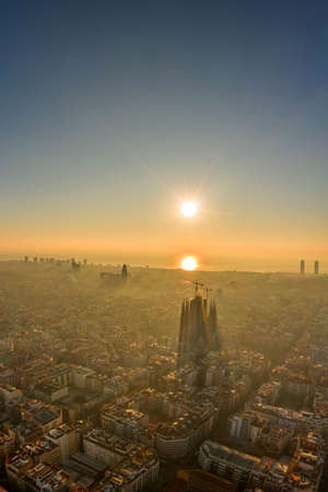 Aerial drone shot of sunrise over Barcelona city center in early morningの写真素材
