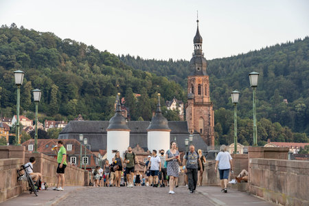 Heidelberg, Germany - Aug 1, 2020: Tourists on old bridge after sunset in summerのeditorial素材