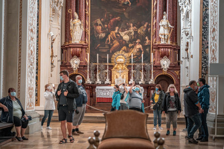 Kempten, Germany - Aug 3, 2020: Altar view of St. Lawrence Basilica with masked touristのeditorial素材