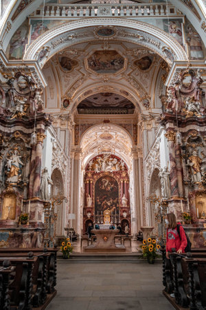 Kempten, Germany - Aug 3, 2020: Altar view of St. Lawrence Basilica with masked touristのeditorial素材