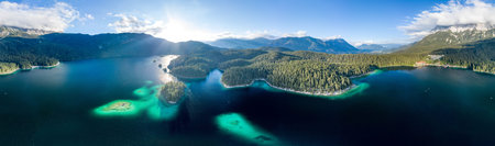 360 Panoramic aerial view of Eibsee lake by Zugspitze in Germany summer before sunset