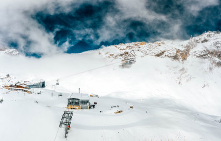 Aerial drone view of Cable car station at Zugspitze top of Germany in summer snow