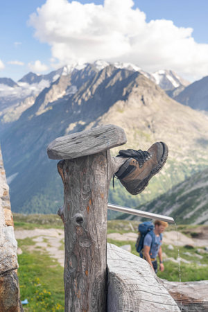 Olpererhutte, Austria - Aug 7, 2020: Lost shoe on top of water faucet outside restaurantのeditorial素材