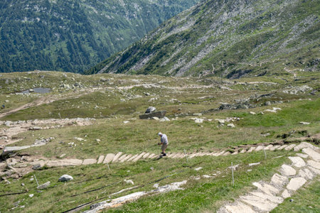 Elder male hike down from Olpererhutte in Austria Zillertal Alpsの写真素材