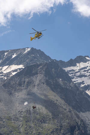 Grossglockner, Austria - Aug 8, 2020: Emergency helicopter rescue ski accident in the mountainのeditorial素材