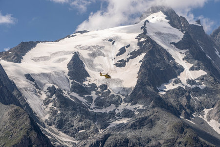 Grossglockner, Austria - Aug 8, 2020: Emergency helicopter rescue ski accident in the mountainのeditorial素材