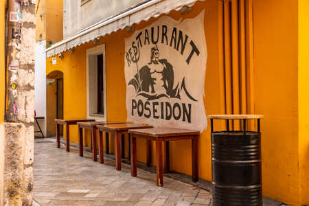 Zadar, Croatia - Aug 12, 2020: Artwork graffiti of Poseidon on restaurant wall in old townのeditorial素材