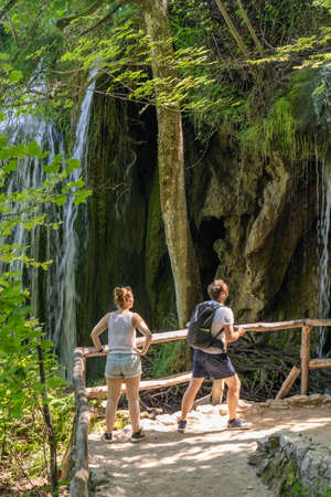 Plitvice, Croatia - Aug 11, 2020: Hikers on trekking road in national parkのeditorial素材