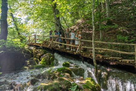 Plitvice, Croatia - Aug 11, 2020: Hikers on trekking road in national parkのeditorial素材