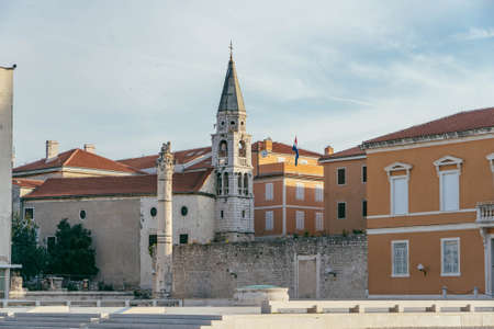 Zadar, Croatia - Aug 13, 2020: Roman relic stone at old town square with view of St. Donatus Churchのeditorial素材