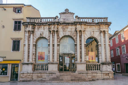 Zadar, Croatia - Aug 13, 2020: Stone facae of city museum in early morningのeditorial素材