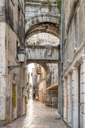 Split, Croatia - Aug 15 2020: Street view of ancient street arch at Diocletian Palace old townのeditorial素材