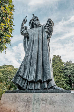 Split, Croatia - Aug 15, 2020: Statue of Grgur Ninski at Golden Gate entrance to Diocletian Palaceのeditorial素材