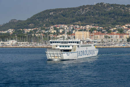 Split, Croatia - Aug 15, 2020: Liner ferry leave old town port in early morningのeditorial素材
