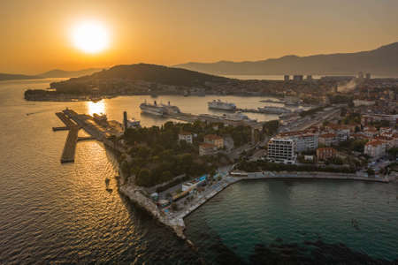 Split, Croatia - Aug 13, 2020: Aerial drone shot of old town harbour for ferry cruise in sunset hourのeditorial素材