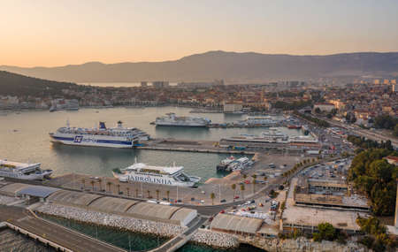 Split, Croatia - Aug 13, 2020: Aerial drone shot of ferry cruise port during sunset hourのeditorial素材