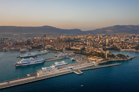 Split, Croatia - Aug 13, 2020: Aerial drone shot of ferry cruise port during sunset hourのeditorial素材