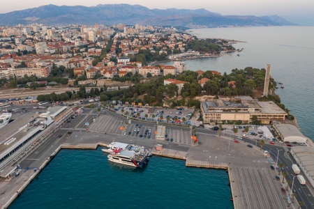 Split, Croatia - Aug 13, 2020: Aerial drone shot of old town harbour for ferry cruise in sunset hourのeditorial素材