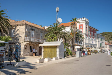 Vis, Croatia - Aug 19, 2020: Riva boulevard by old town port in summerのeditorial素材