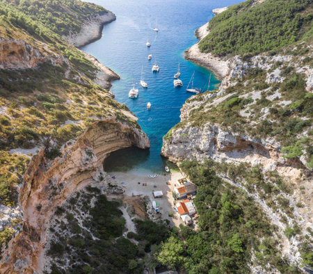 Aerial drone shot of iconic Stiniva cove beach of Adriatic sea on Vis Island in Croatia summer