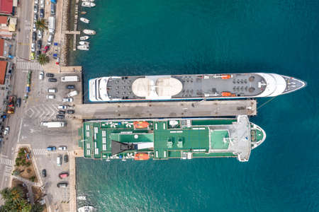 Aerial overhead drone shot of ferry cruise at Vis Island port in Adriatic sea in Croatia summerの写真素材