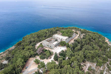 Aerial drone shot of stone Fort George Croatia on top of hill in Adriatic sea on Vis Island in summerの写真素材