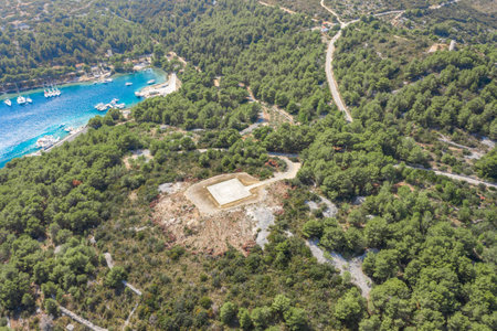 Aerial drone shot of Heliport on top of hill near port of Vis Island in Croatia summerの写真素材