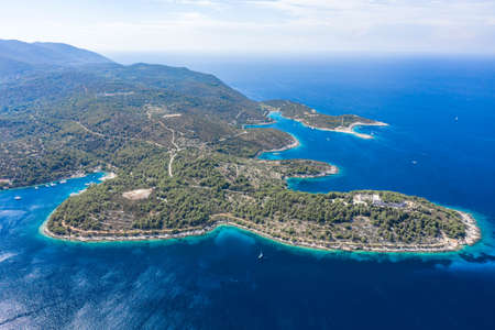 Aerial drone high angle shot of peninsula of Vis Island coastline in Adriatic sea in Croatia summerの写真素材
