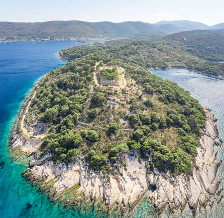 Aerial drone shot of stone Fort George Croatia on top of hill in Adriatic sea on Vis Island in summerの写真素材