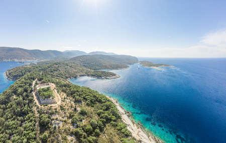 Aerial drone shot of stone Fort George Croatia on top of hill in Adriatic sea on Vis Island in summerの写真素材