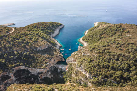 Aerial view of Stiniva cove beach of Adriatic sea on Vis Island in Croatiaの写真素材