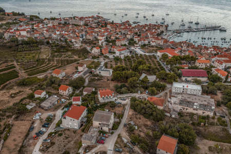 Aerial view of adriatic sea Komiza town on Vis Island in Croatiaの写真素材