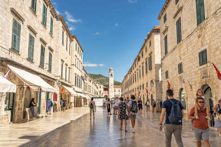 Dubrovnik, Croatia - Aug 20, 2020: Tourists walk on Stradun main street in summer timeのeditorial素材