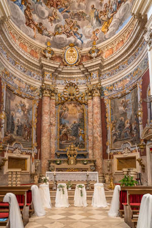 Dubrovnik, Croatia - Aug 20, 2020: Altar view inside St. Ignatius church after wedding with veil on the benchのeditorial素材