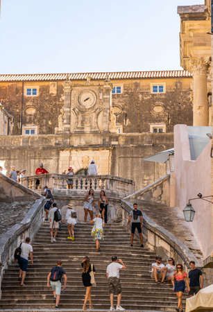Dubrovnik, Croatia - Aug 20, 2020: Tourists on Jesuit stone stairs in old town in summerのeditorial素材