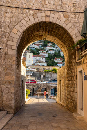 Dubrovnik, Croatia - Aug 22, 2020: City wall empty entrance gate into Old town in summer morningのeditorial素材