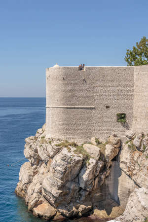 Dubrovnik, Croatia - Aug 22, 2020: Tourists on top of Fort St. Margaret city wall in old town in summerのeditorial素材