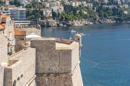 Dubrovnik, Croatia - Aug 22, 2020: Tourists on top of Fort St. Margaret city wall in old town in summerのeditorial素材