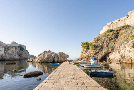 Dubrovnik, Croatia - Aug 23, 2020: Empty west harbour in Dubrovnik old town in summer morningのeditorial素材