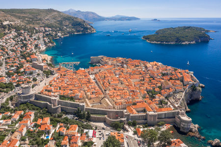 Aerial drone shot of Otok Lokrum in Adriatic sea near Dubrovnik old town in Croatia summer noonの写真素材